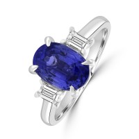 Platinum Three-stone Oval Sapphire and Baguette Diamond ring